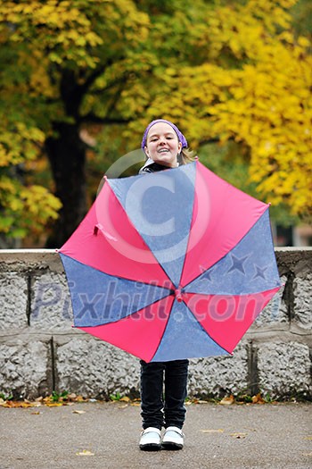 happy girl with umbrella outdoor in park on autumn season rain day happy girl with umbrella outdoor in park on autumn season rain day