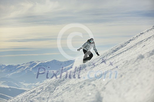 snowboard woman racing downhill slope and freeride on powder snow at winter season and sunny day snowboard woman racing downhill slope and freeride on powder snow at winter season and sunny day