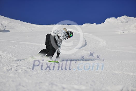 snowboard woman racing downhill slope and freeride on powder snow at winter season and sunny day snowboard woman racing downhill slope and freeride on powder snow at winter season and sunny day