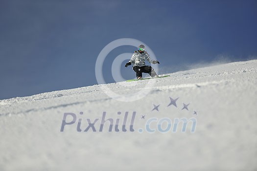 snowboard woman racing downhill slope and freeride on powder snow at winter season and sunny day snowboard woman racing downhill slope and freeride on powder snow at winter season and sunny day