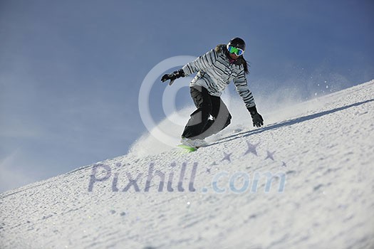 snowboard woman racing downhill slope and freeride on powder snow at winter season and sunny day snowboard woman racing downhill slope and freeride on powder snow at winter season and sunny day