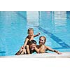 happy young family have fun on swimming pool  at summer vacation