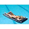 beautiful young woman relax and have fun at swimming pool