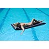 beautiful young woman relax and have fun at swimming pool