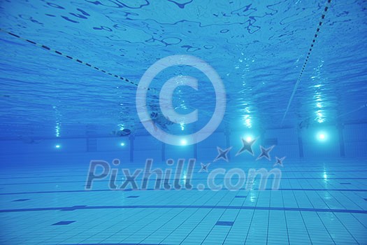 sport swimming pool underwater with blue color and swimmers sport swimming pool underwater with blue color and swimmers