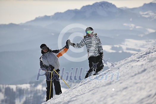 happy couple drivingand relaxing with snowboard and ski at winter seasson on mountain happy couple drivingand relaxing with snowboard and ski at winter seasson on mountain