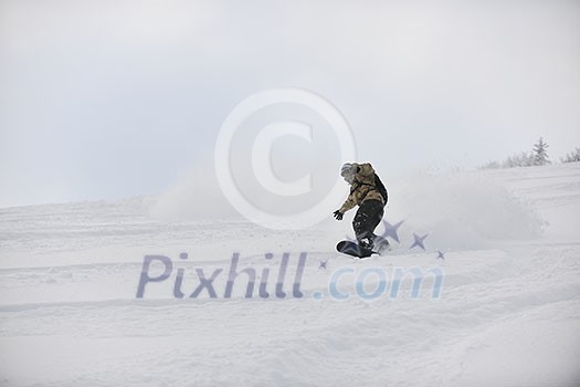 freestyle snowboarder jump and ride free style at sunny winter day on mountain freestyle snowboarder jump and ride free style at sunny winter day on mountain