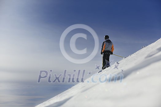 man ski free ride downhill at winter season on beautiful sunny day and powder snow
