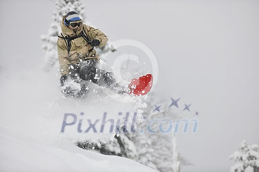 freestyle snowboarder jump and ride free style at sunny winter day on mountain freestyle snowboarder jump and ride free style at sunny winter day on mountain