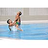 happy father and son have fun at swimming pool