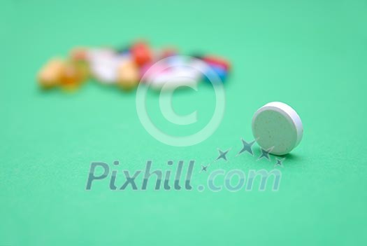 pills on green background pills on green background