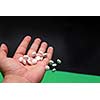 pills in human hand
