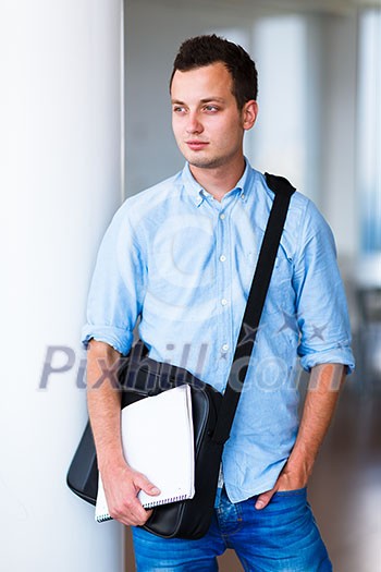 Handsome college student on campus (shallow DOF; color toned image) Handsome college student on campus (shallow DOF; color toned image)