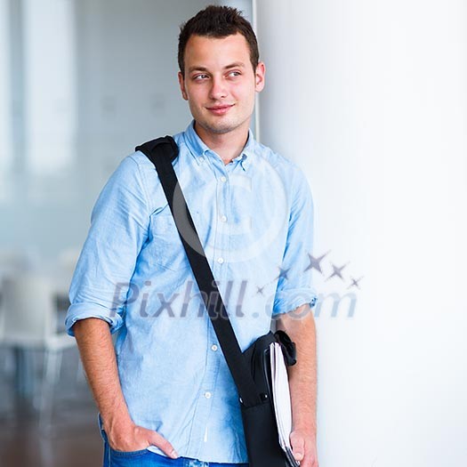 Handsome college student on campus (shallow DOF; color toned image) Handsome college student on campus (shallow DOF; color toned image)