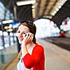 Pretty young woman at a train station