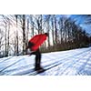 Cross-country skiing: young man cross-country skiing on a lovely sunny winter day