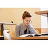 pretty female college student in a llibrary (color toned image)