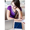 Pretty female college student in classroom (color toned image)