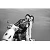 wedding sce of bride and groom just married couple on the beach ride white scooter and have fun