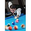young pro billiard player finding best solution and right angle at billard or snooker pool sport  game 