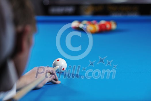 young pro billiard player finding best solution and right angle at billard or snooker pool sport game young pro billiard player finding best solution and right angle at billard or snooker pool sport game