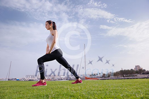 Young beautiful woman jogging and running on morning at park in the city. Woman in sport outdoors health and fitness concept Young beautiful woman jogging and running on morning at park in the city. Woman in sport outdoors health and fitness concept