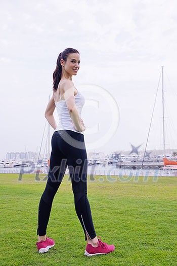 Young beautiful woman jogging and running on morning at park in the city. Woman in sport outdoors health and fitness concept Young beautiful woman jogging and running on morning at park in the city. Woman in sport outdoors health and fitness concept