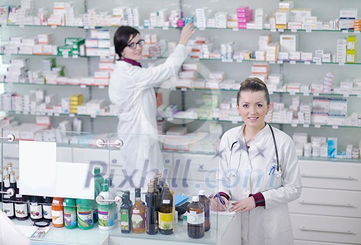 team of pharmacist chemist woman group standing in pharmacy drugstore team of pharmacist chemist woman group standing in pharmacy drugstore