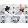 team of  pharmacist chemist woman group  standing in pharmacy drugstore