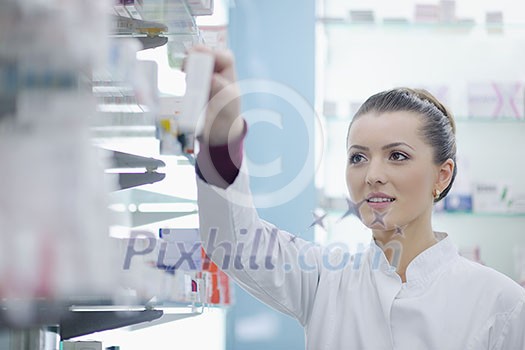 Happy cheerful pharmacist chemist woman standing in pharmacy drugstore Happy cheerful pharmacist chemist woman standing in pharmacy drugstore