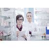 team of  pharmacist chemist woman group  standing in pharmacy drugstore
