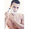 young handsome man have shaving isolated on white