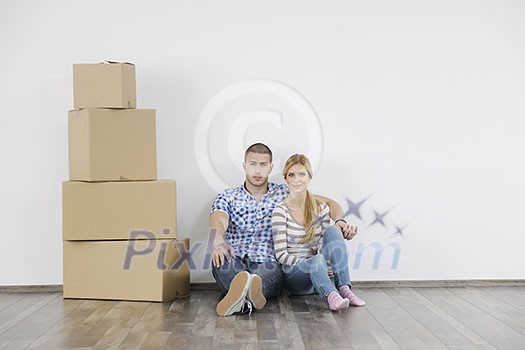 happy Young couple moving in new home happy Young couple moving in new home