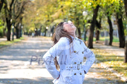 brunette Cute young woman smiling outdoors in nature brunette Cute young woman smiling outdoors in nature