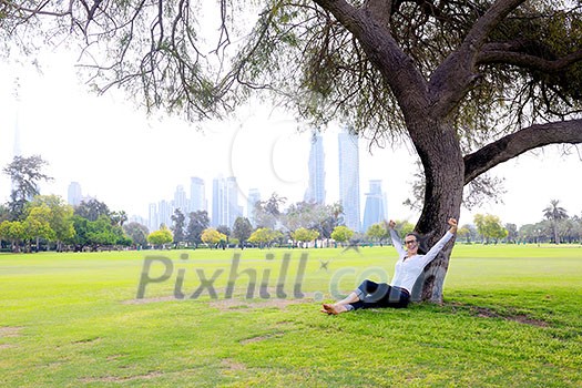 Beautiful young student  woman study with tablet in park