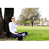 Beautiful young student  woman study with tablet in park