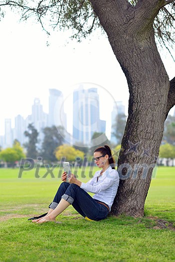 Beautiful young student woman study with tablet in park Beautiful young student woman study with tablet in park