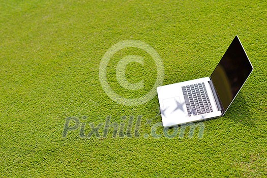 laptop comuter on grass, freedom communication concetp and education and study laptop comuter on grass, freedom communication concetp and education and study