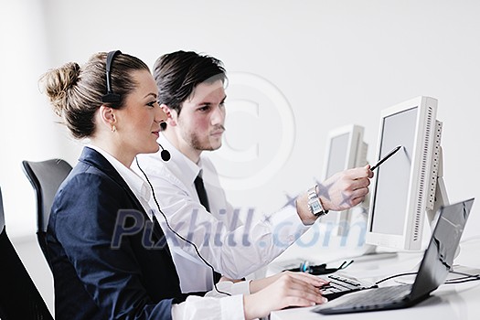 business people group with headphones giving support in help desk office to customers, manager giving training and education instructions business people group with headphones giving support in help desk office to customers, manager giving training and education instructions