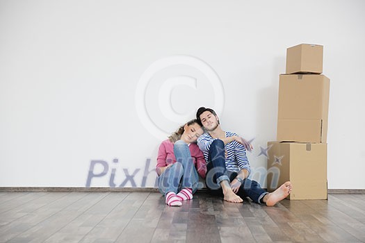 happy Young couple moving in new home happy Young couple moving in new home