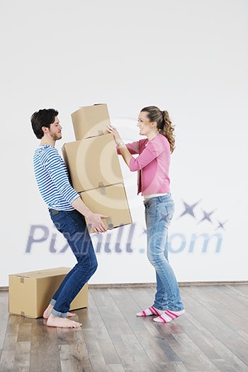 happy Young couple moving in new home happy Young couple moving in new home