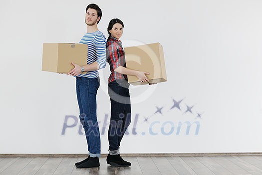 happy Young couple moving in new home happy Young couple moving in new home