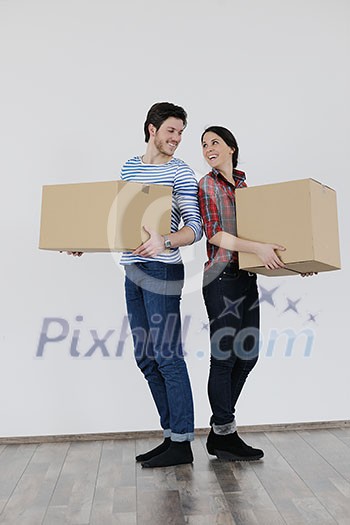 happy Young couple moving in new home happy Young couple moving in new home