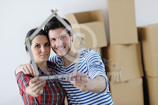 happy Young couple moving in new house happy Young couple moving in new house