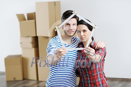 happy Young couple moving in new house happy Young couple moving in new house