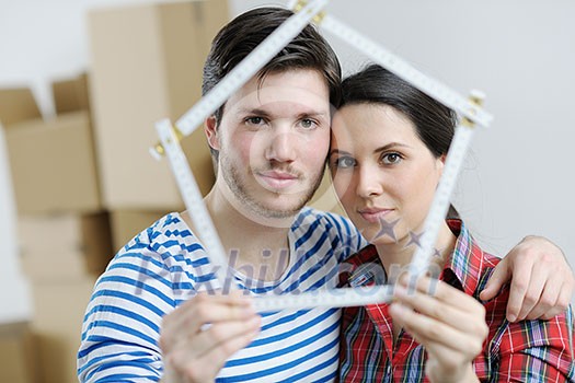 happy Young couple moving in new house happy Young couple moving in new house