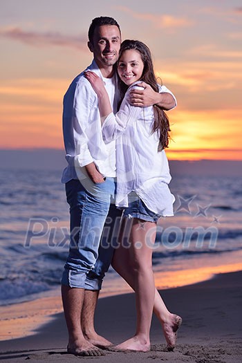happy young romantic couple in love have fun on beautiful beach at beautiful summer day happy young romantic couple in love have fun on beautiful beach at beautiful summer day