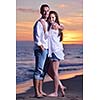 happy young romantic couple in love have fun on beautiful beach at beautiful summer day