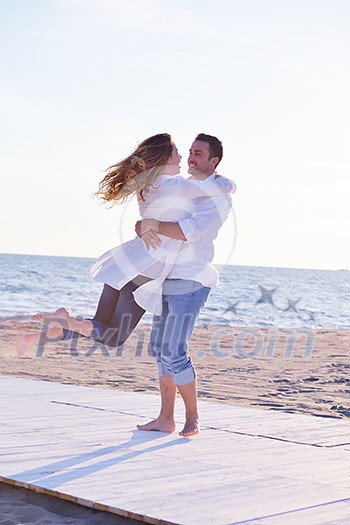 happy young romantic couple in love have fun on beautiful beach at beautiful summer day happy young romantic couple in love have fun on beautiful beach at beautiful summer day