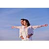 happy young romantic couple in love have fun on beautiful beach at beautiful summer day